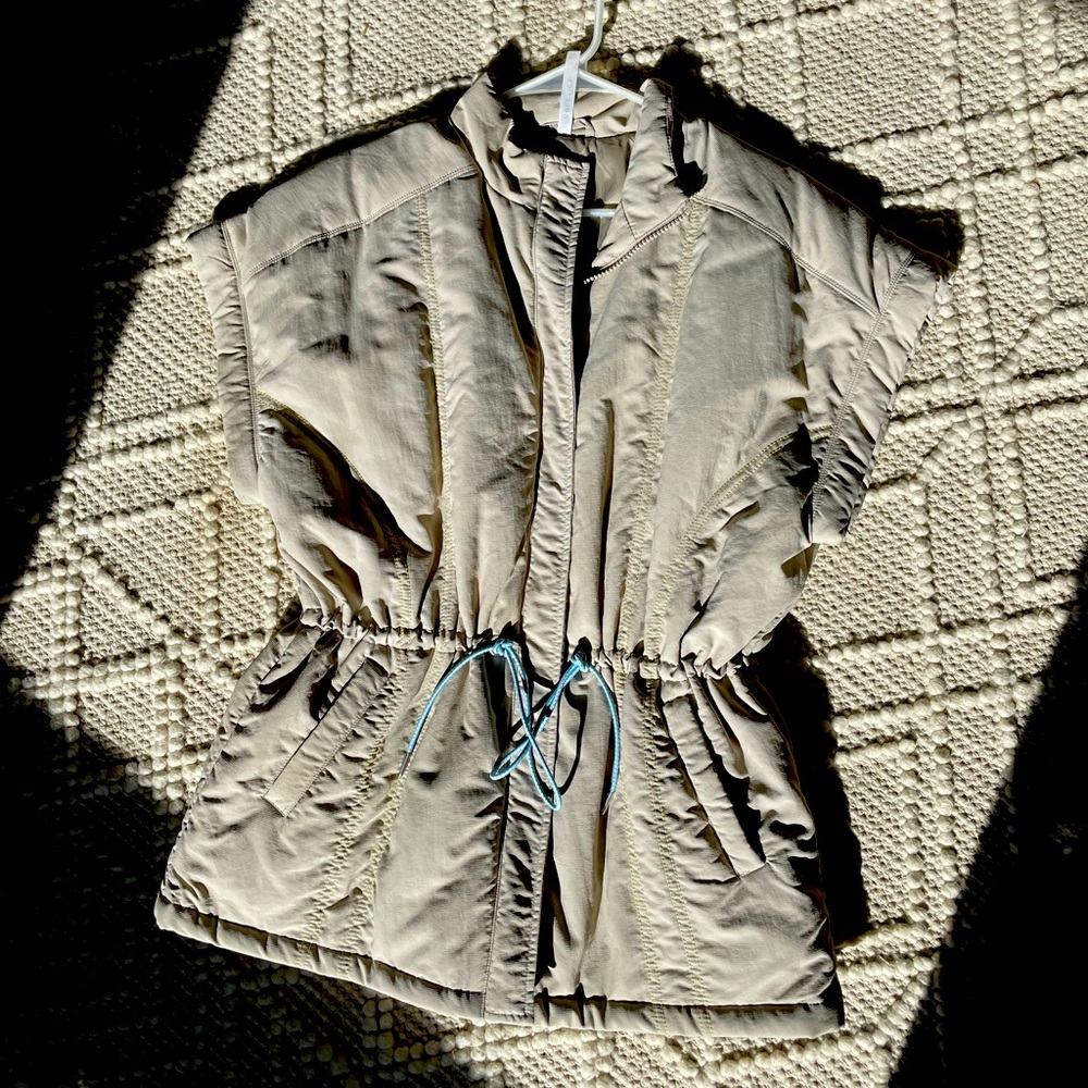 Women’s Large beige tan puffer vest , green thread and blue detail.